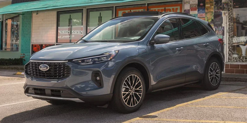A grey 2026 Ford Escape parked outside a store.